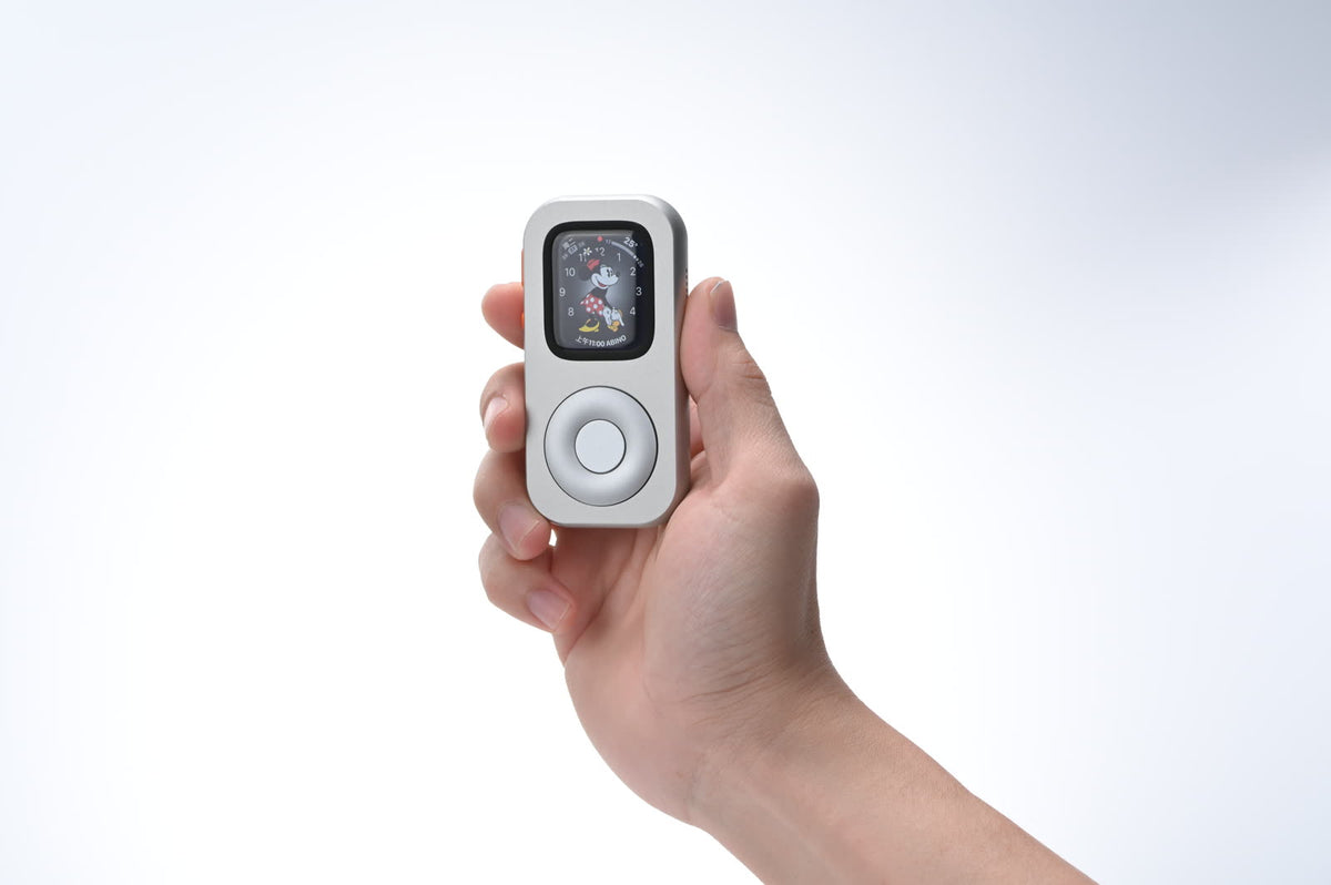 A front-facing RePod held in one hand with a character clock face visible