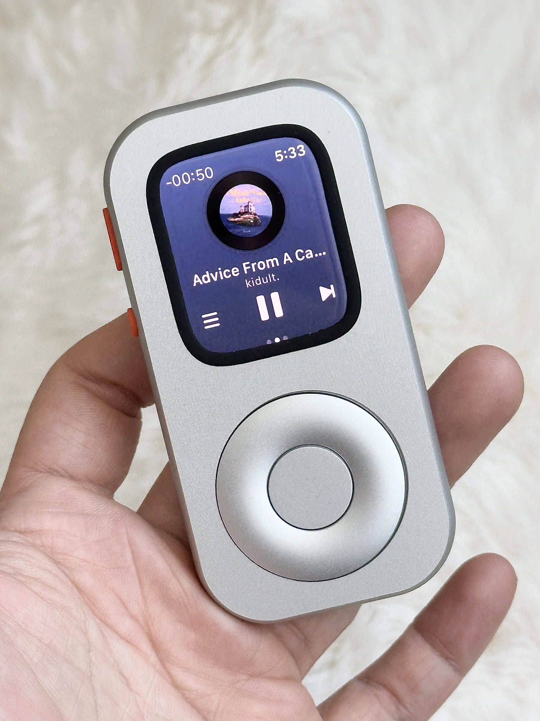 RePod held in one hand while an album plays on Apple Watch